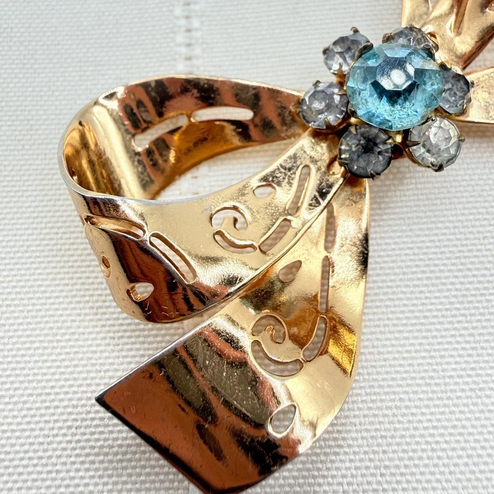 Vintage CORO Gray and Blue Rhinestones Gold Tone Cutout Bow Pin Brooch